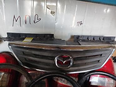Решетка радиатора Mazda 2002 г., Б/у, Оригинал at lalafo.kg Решетка радиатора Mazda 2002 г., Б/у, Оригинал