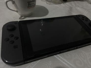 Игровая консоль Nintendo Switch (серые Joy‑Con) - Универсальная at lalafo.kg Игровая консоль Nintendo Switch (серые Joy‑Con) - Универсальная