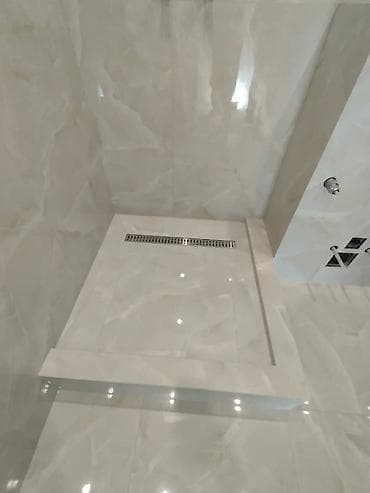 Плиточные работы под ключ: ванные комнаты и душевые - Облицовка стен at lalafo.kg Плиточные работы под ключ: ванные комнаты и душевые - Облицовка стен