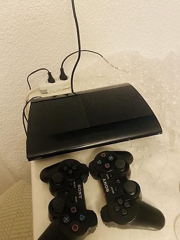 Игровая приставка Sony PlayStation 3 Super Slim (чёрная) с двумя lalafo.kg да Игровая приставка Sony PlayStation 3 Super Slim (чёрная) с двумя