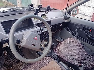 Mitsubishi Colt — салон и интерьерные элементы. - Руль оригинальный at lalafo.kg Mitsubishi Colt — салон и интерьерные элементы. - Руль оригинальный