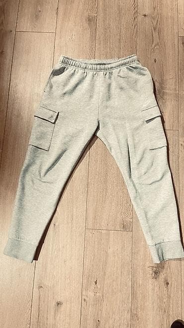 Серые спортивные джоггеры-карго Nike. Люкс - Цвет: светло‑серый меланж at lalafo.kg Серые спортивные джоггеры-карго Nike. Люкс - Цвет: светло‑серый меланж