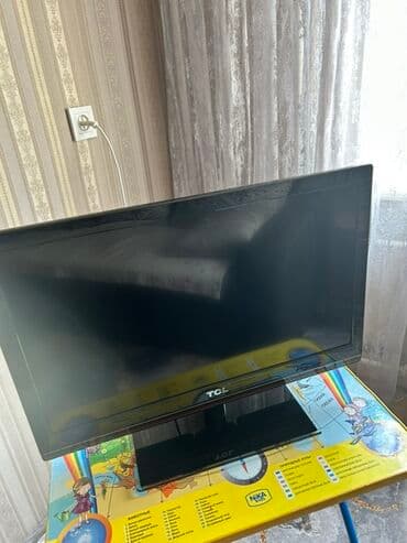 Телевизор TCL с черной рамкой и подставкой. Подходит для просмотра at lalafo.kg Телевизор TCL с черной рамкой и подставкой. Подходит для просмотра