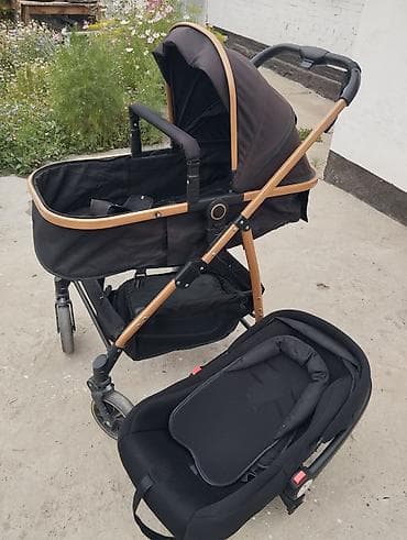 Коляска автолюлькасы менен 2в1, түсү кара жана алтын түстө, 2 ай at lalafo.kg Коляска автолюлькасы менен 2в1, түсү кара жана алтын түстө, 2 ай