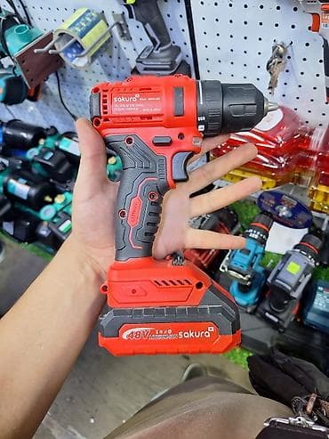 Аккумуляторная дрель-шуруповерт Sakura в красно-черном корпусе at lalafo.kg Аккумуляторная дрель-шуруповерт Sakura в красно-черном корпусе