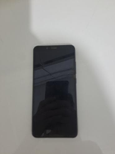 Смартфон черного цвета с металлической задней крышкой и сканером at lalafo.kg Смартфон черного цвета с металлической задней крышкой и сканером