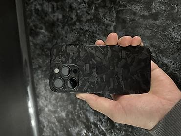 IPhone с тремя основными камерами (линейка Pro). На корпус нанесена at lalafo.kg IPhone с тремя основными камерами (линейка Pro). На корпус нанесена