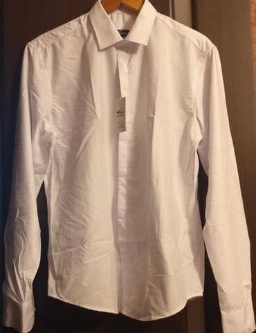 Продаю новую рубашку мужскую белого цвета с передней планочкой, размер at lalafo.kg Продаю новую рубашку мужскую белого цвета с передней планочкой, размер