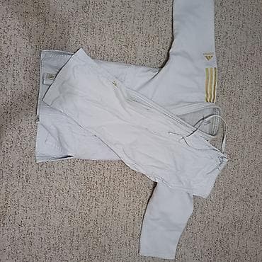 Кимоно для дзюдо adidas (куртка и штаны) - Цвет: белый с золотистыми at lalafo.kg Кимоно для дзюдо adidas (куртка и штаны) - Цвет: белый с золотистыми