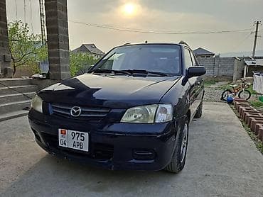 Mazda Demio (DW) — компактный 5‑дверный хэтчбек темно‑синего цвета at lalafo.kg Mazda Demio (DW) — компактный 5‑дверный хэтчбек темно‑синего цвета