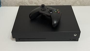 Игровая консоль Xbox One X (чёрная) Состояние 9-10 Память 1TB. Один at lalafo.kg Игровая консоль Xbox One X (чёрная) Состояние 9-10 Память 1TB. Один