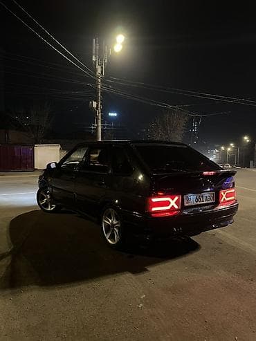 Автомобиль хэтчбек темного цвета с доработанным экстерьером. Ключевые at lalafo.kg Автомобиль хэтчбек темного цвета с доработанным экстерьером. Ключевые