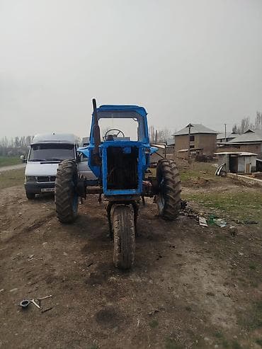 Колёсный трактор (с высокой посадкой), с кабиной, синим окрашиванием at lalafo.kg Колёсный трактор (с высокой посадкой), с кабиной, синим окрашиванием